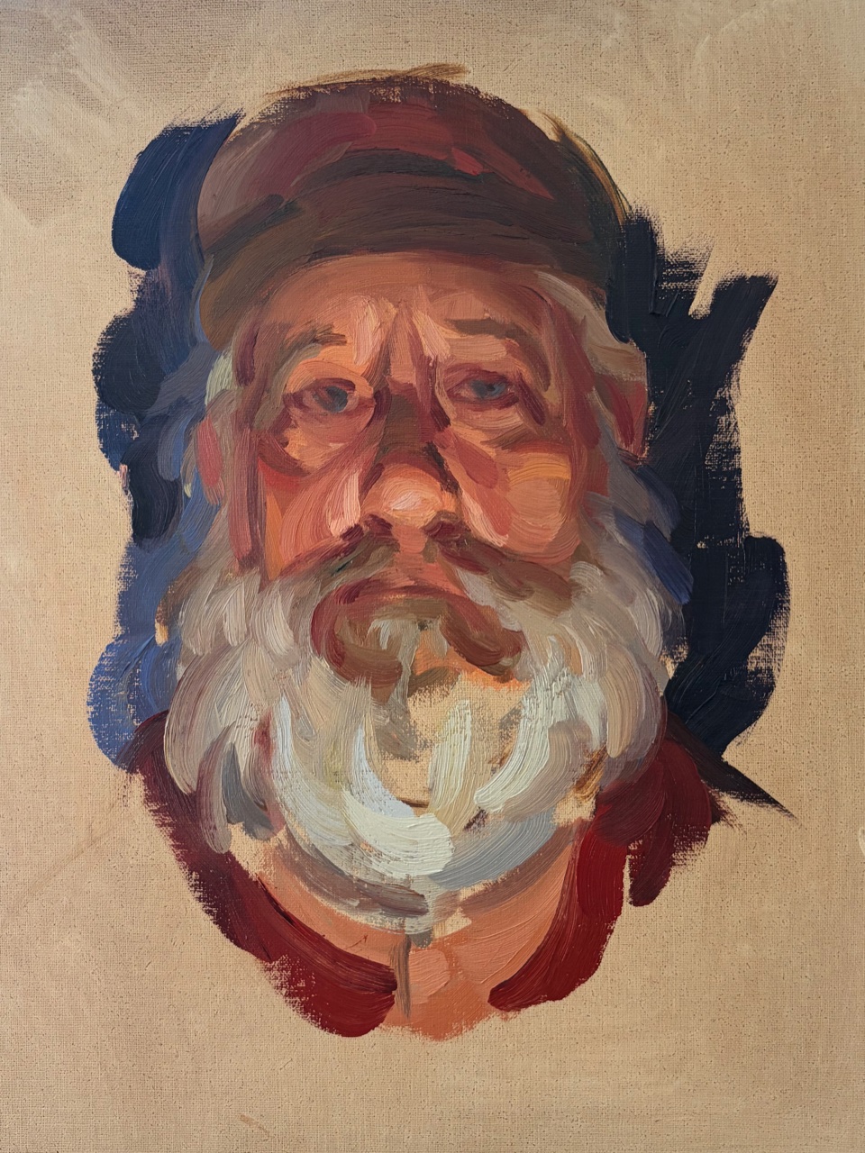 Portrait of a man with a white beard and cap