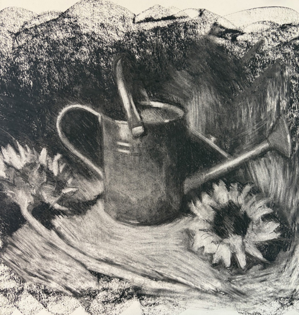 Sunflowers and a watering can